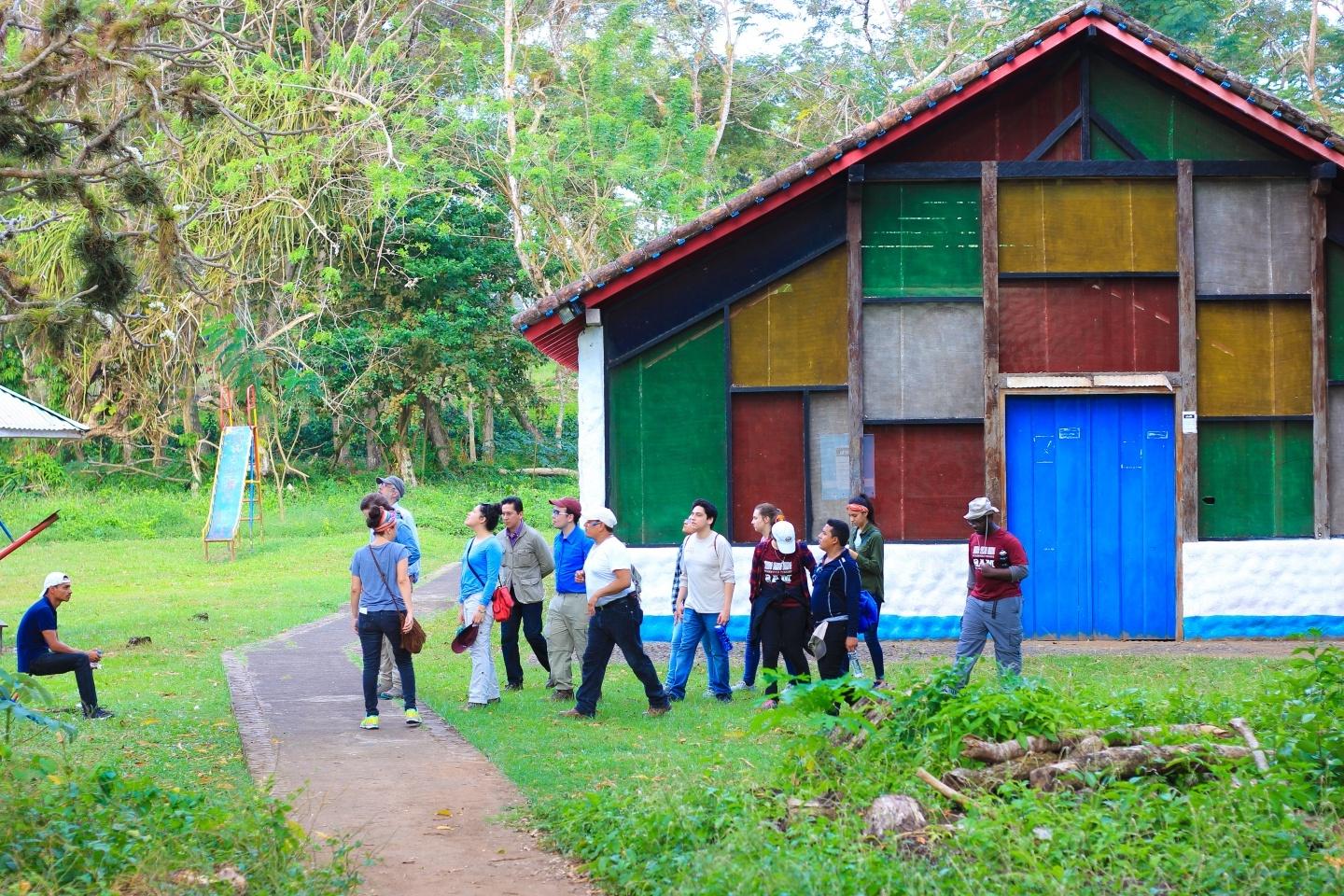 Group of students experiencing a new culture and a colorful building